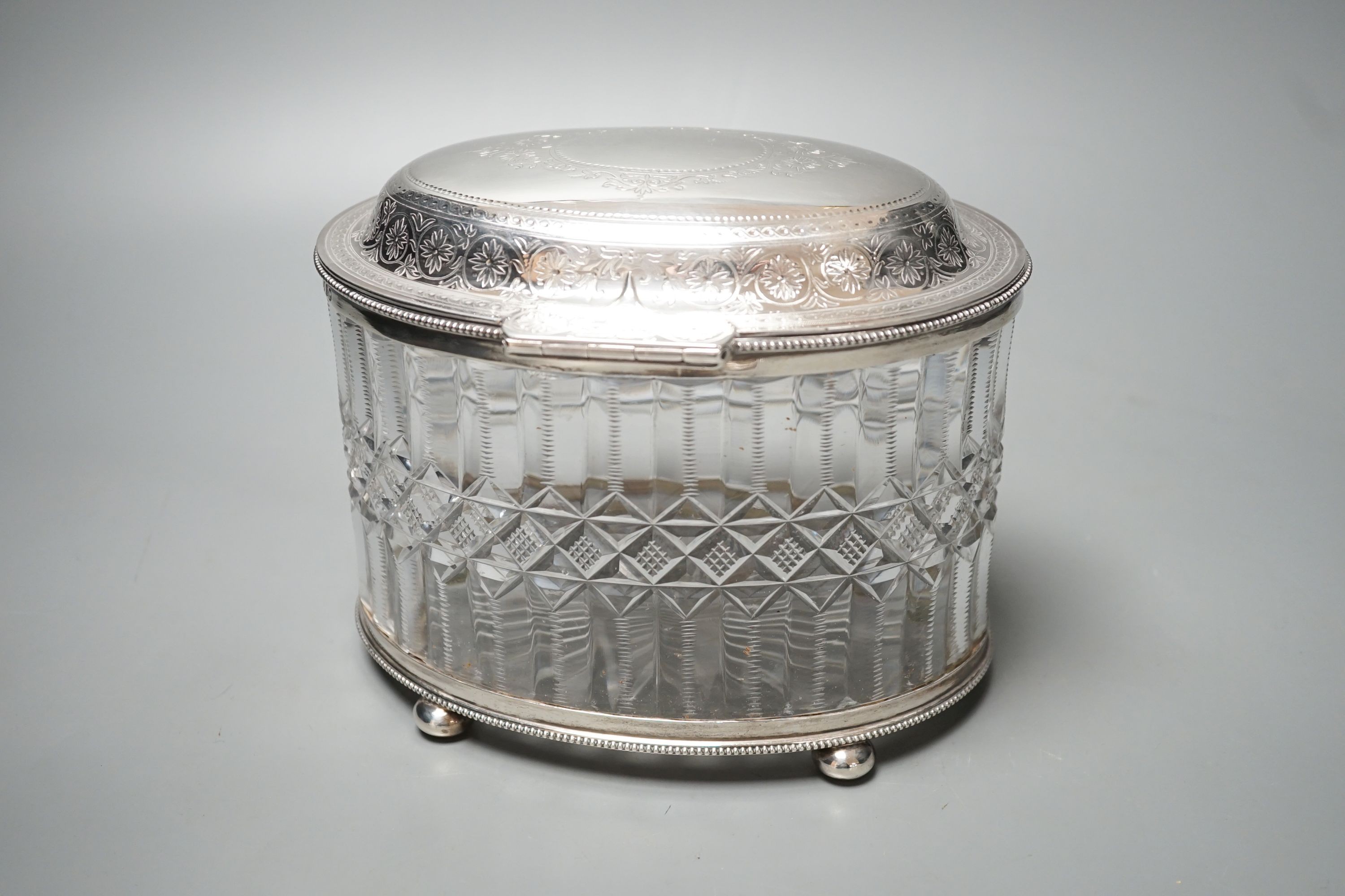 A Victorian engraved silver mounted cut glass oval biscuit barrel, double stamped maker's mark, London, 1874, height 15.5cm.